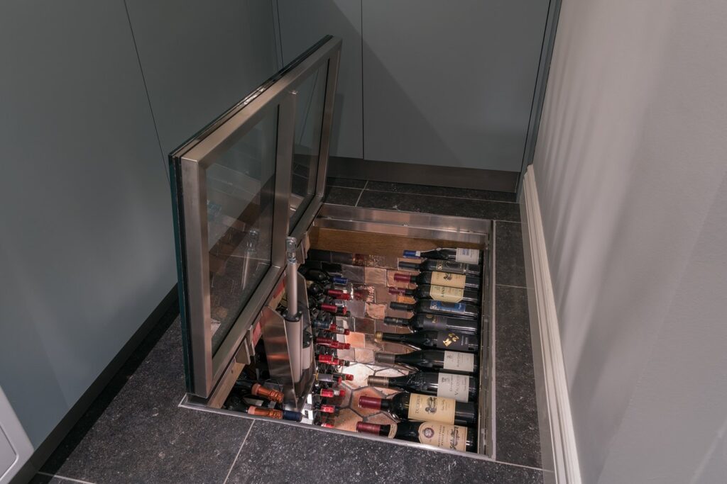 Glass floor hatch for wine storage pantry