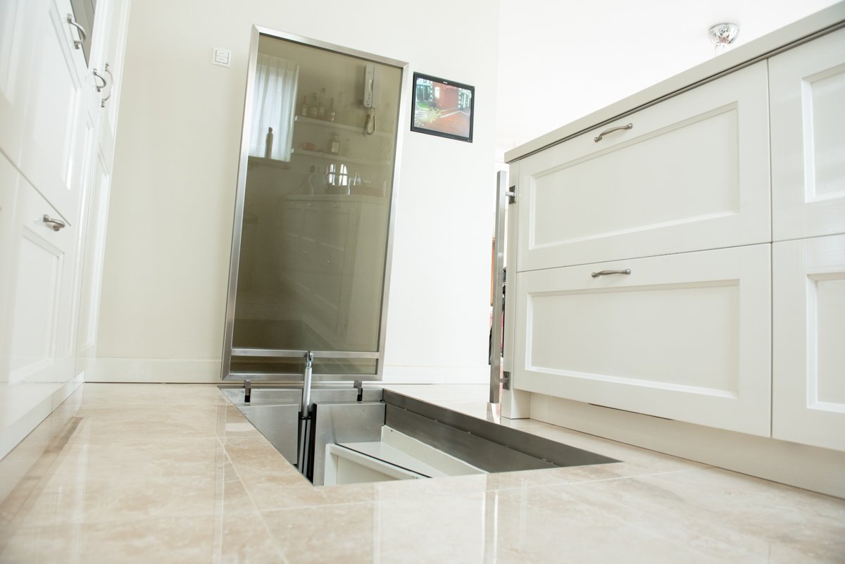 Glass floor hatch for wine cellar